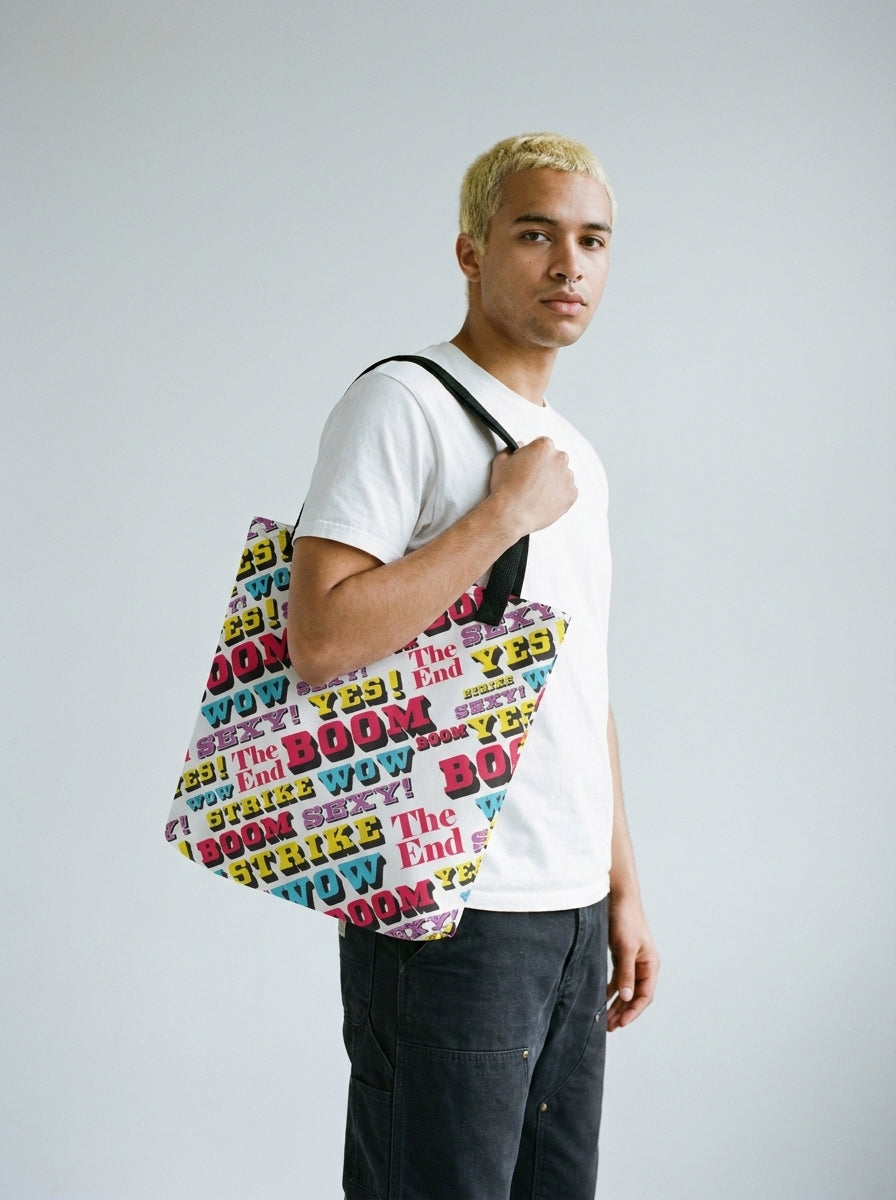Model with bleached hair and septum piercing carrying the Strike all-over print tote bag by Design Hero, analog film photo