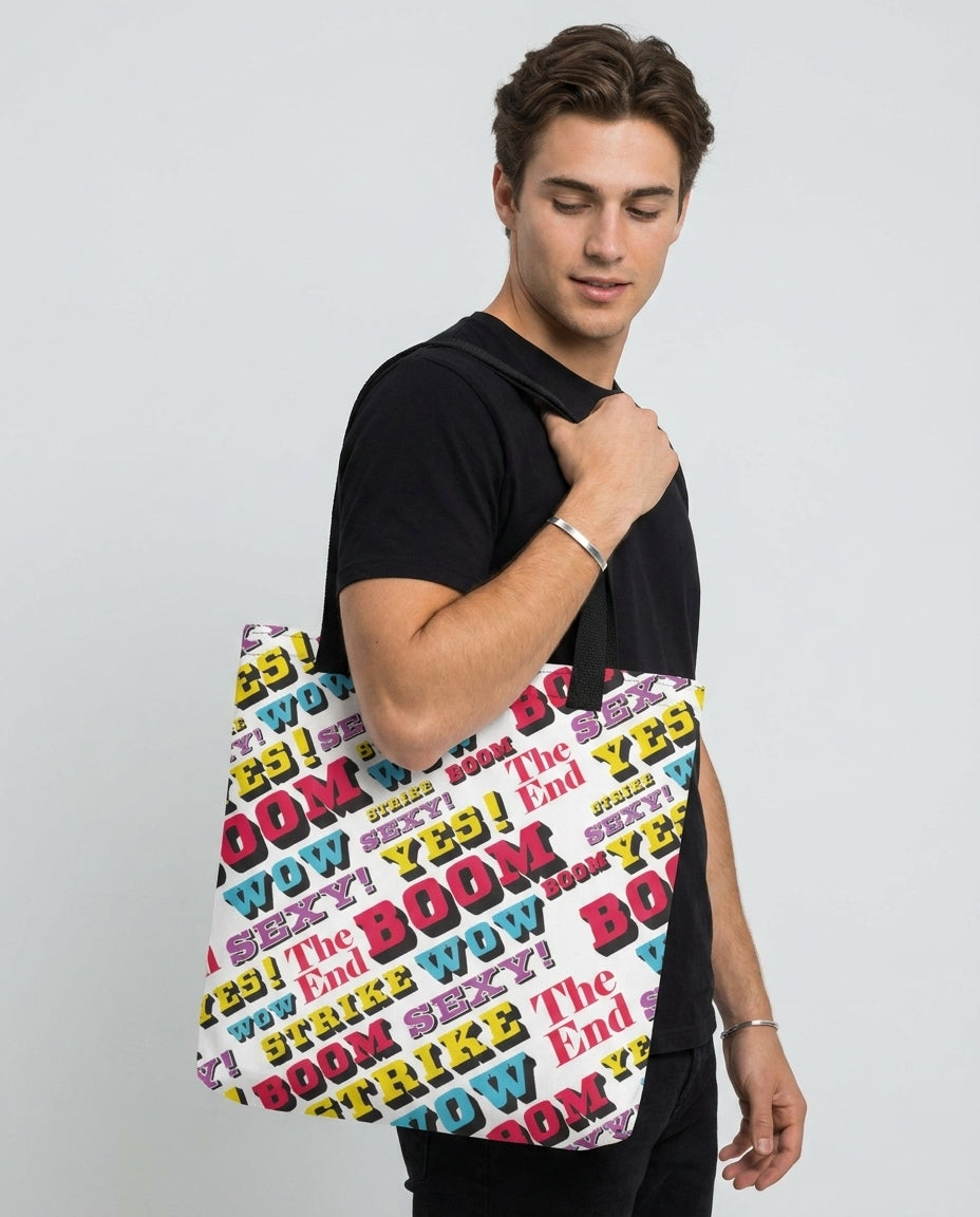 Man wearing the Strike all-over print tote bag by Design Hero, comic pop art design, studio photo