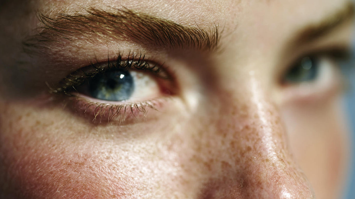 Close-up of a person's eye with detailed skin texture