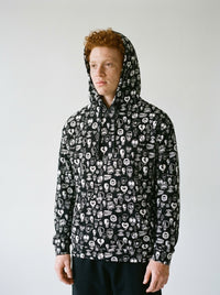 Model wearing the Black Skull hoodie by Design Hero, analog film photo