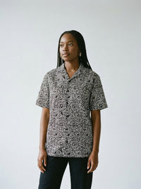 Model wearing the BOOM! graphic button shirt by Design Hero, analog film photo