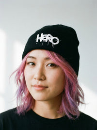 Hero Pom Pom Knit Cap designed by Hero worn by a model