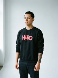Model wearing the Hero crewneck sweatshirt by Design Hero, analog film photo