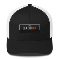 The Black Box trucker cap black front with white mesh back and embroidered patch – premium two-tone cap for filmmakers
