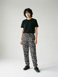 Skull Print Unisex Track Pants by HERO: Stand Out in Style and Comfort worn by a model
