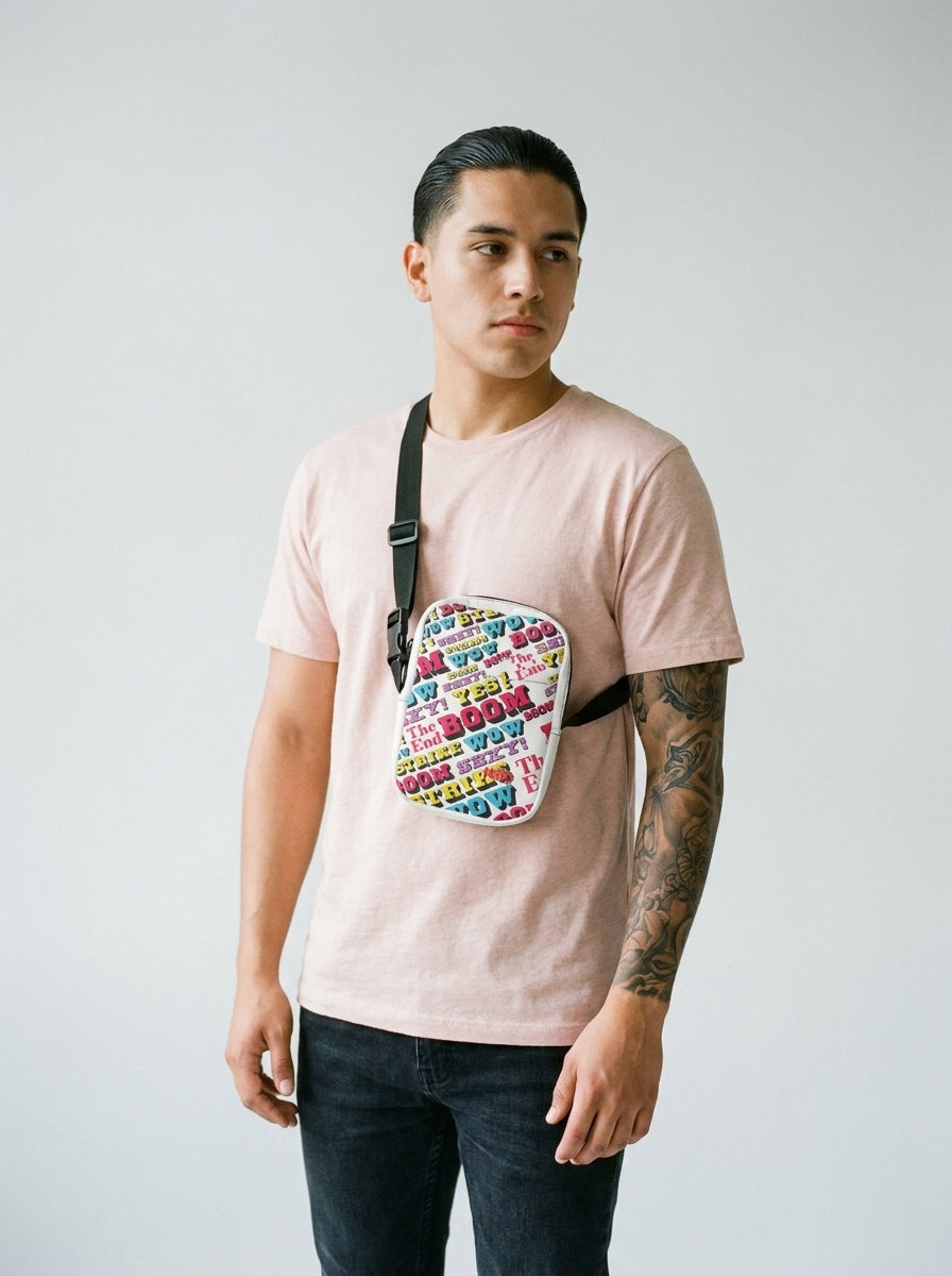Model with tattoo sleeve wearing the Strike utility crossbody bag by Design Hero, analog film photo