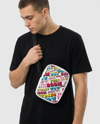 Man wearing the Strike utility crossbody bag by Design Hero, comic pop art all-over print, studio photo