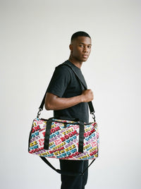 Model carrying the Strike duffle bag by Design Hero, analog film photo