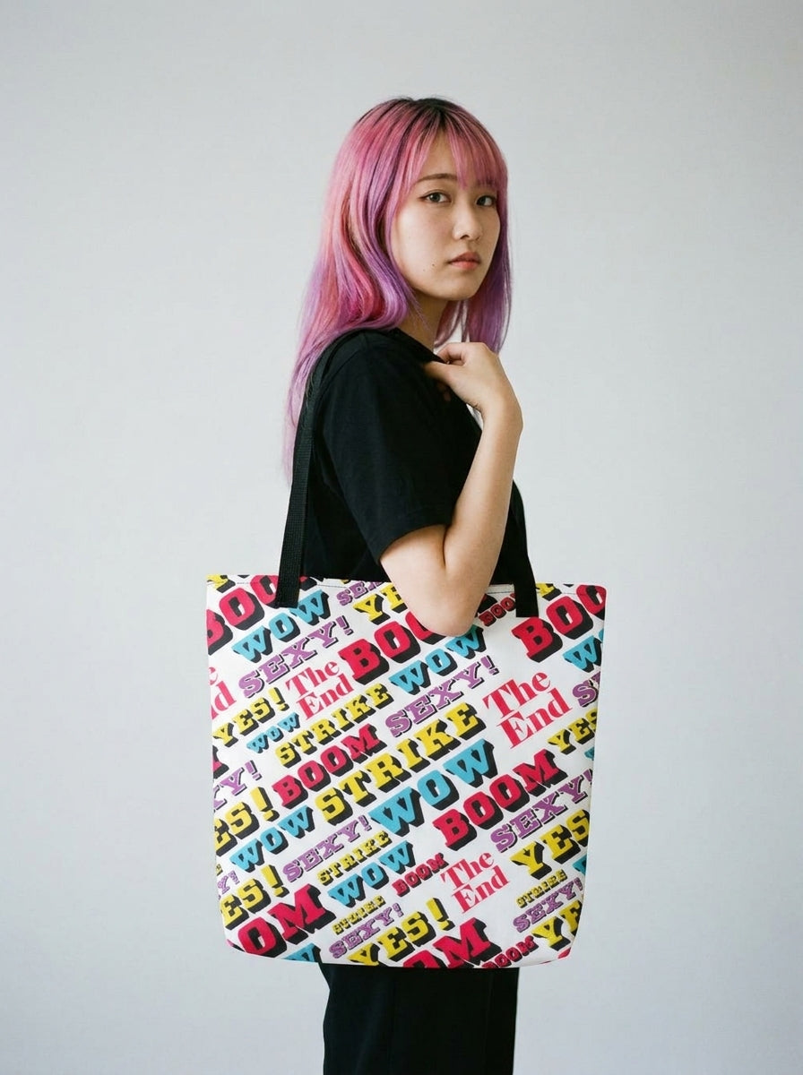 Model with pink and purple hair carrying the Strike large tote bag by Design Hero, analog film photo