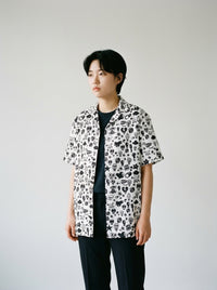 Model wearing the White Skull button shirt by Design Hero, analog film photo